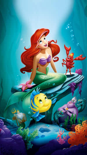 Ariel Singing Along In The Vibrant Underwater World Of The Little Mermaid Wallpaper