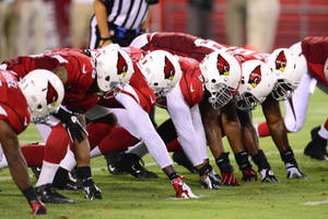 Arizona Cardinals Players On The Field Wallpaper