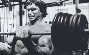 Arnold Schwarzenegger Heavy Dumbbell Wallpaper