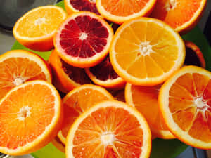 Assorted Citrus Fruits Sliced Wallpaper