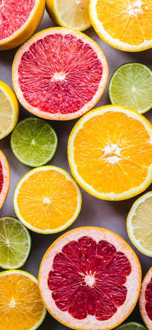 Assorted Citrus Fruits Sliced Wallpaper