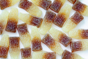 Assorted Cola Gummies In Vibrant Tones Wallpaper