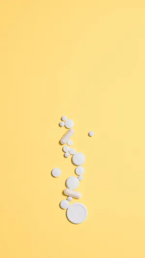 Assorted Pillson Yellow Background Wallpaper
