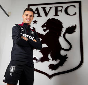 Aston Villa's Coutinho Beside Logo Wallpaper