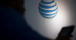 At&t's Logo Is Seen On A Wall Wallpaper