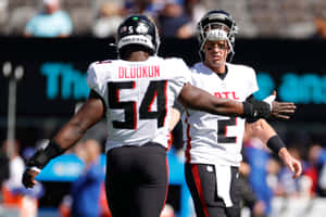 Atlanta Falcons Foyesade Oluokun And Matt Ryan Wallpaper