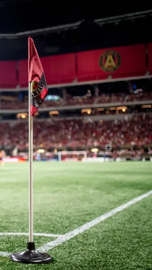 Atlanta United Fc Flag And Supporters At Mercedes Benz Stadium Wallpaper