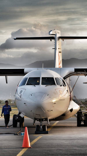 Atr 72 Turboprop Aircraft In Mid-flight Wallpaper