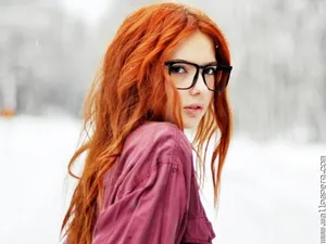 Attitude Girl With Orange Hair And Glasses Wallpaper