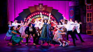 Audience Applauding A Spectacular Performance Of A Musical Wallpaper