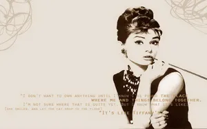Audrey Hepburn In Her Iconic Role As Holly Golightly In The Classic Film Breakfast At Tiffanys Wallpaper