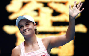 Australian Tennis Icon Ashleigh Barty Waving To Supporters Wallpaper