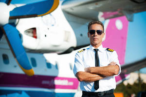 Aviator In Front Of Airplane Wallpaper