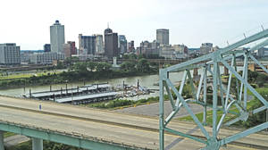 Awe-inspiring View Of The Mississippi River And Downtown Memphis Skyline At Dusk Wallpaper