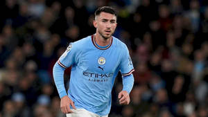 Aymeric Laporte Running In Blue Shirt Wallpaper