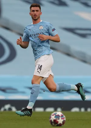 Aymeric Laporte Running With Starry Football Wallpaper