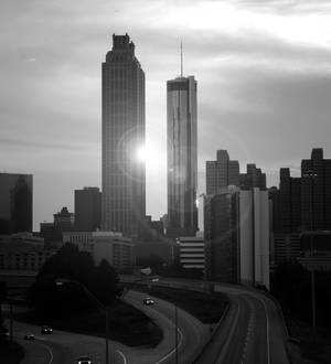 B&w Atlanta Skyline With Sunrays Wallpaper