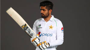 Babar Azam Flaunting His Skills In White Pepsi Uniform Wallpaper