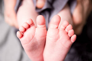 Baby Boy With Petite Feet Wallpaper