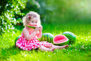 Baby Girl Eating Wallpaper