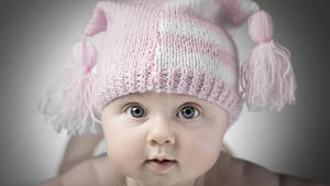 Baby Photography With Pink Crochet Bonnet Wallpaper