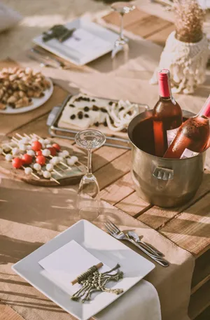 Bachelorette Party Spread On Wooden Table Wallpaper