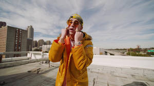 Bad Bunny Matching Orange Outfit Wallpaper