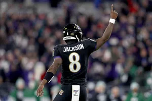 Baltimore Ravens Quarterback Lamar Jackson Celebrates The Teams Winning Drive Of The 2019 Season Wallpaper