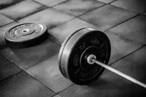 Barbell On Gym Floor Wallpaper