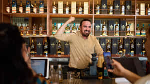 Bartender Enjoying Work Moment.jpg Wallpaper