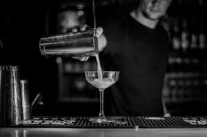 Bartender Pouring Cocktail Blackand White Wallpaper