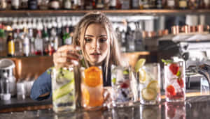 Bartender Preparing Fruit Cocktails Wallpaper