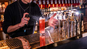 Bartender Spraying Cocktail Garnish.jpg Wallpaper