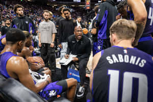 Basketball Coach Strategy Discussion Wallpaper