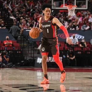 Basketball Player Dribblingon Court Wallpaper