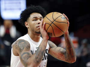 Basketball Player Free Throw Focus Wallpaper