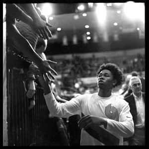 Basketball Player High Fiving Fans Wallpaper