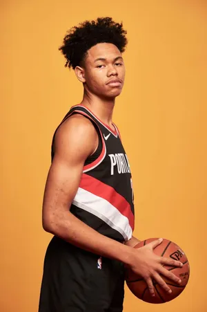 Basketball_ Player_ Portrait_ Orange_ Background.jpg Wallpaper