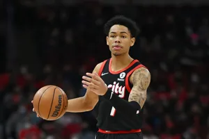 Basketball Playerin Action Dribbling Wallpaper