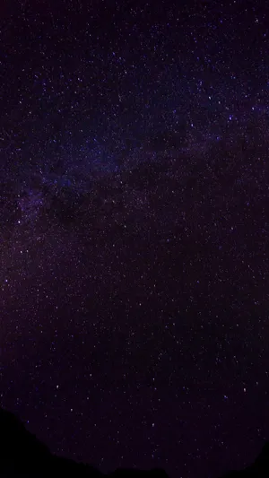 Beautiful Dark Purple Galaxy In Space Wallpaper