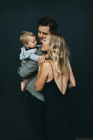 Beautiful Family Portrait Of Three Wallpaper