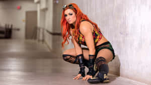 Becky Lynch Crouch Pose Wallpaper