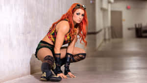 Becky Lynch Crouching On Floor Wallpaper