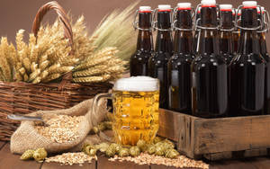 Beer Bottle With Fresh Ingredients Wallpaper