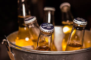 Beer Bottles Inside A Bucket Wallpaper