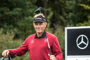 Bernhard Langer Golf Club On His Shoulder Wallpaper