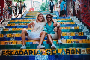 Best Friends Take Time To Look Down On Life's Adventures. Wallpaper