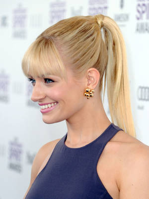 Beth Behrs Bangs And Ponytail Wallpaper