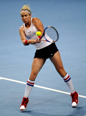 Bethanie Mattek-sands In Action On The Tennis Court Wallpaper