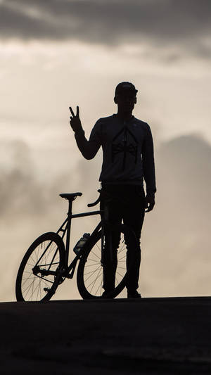 Bike Rider Silhouette With His Bicycle Iphone Wallpaper